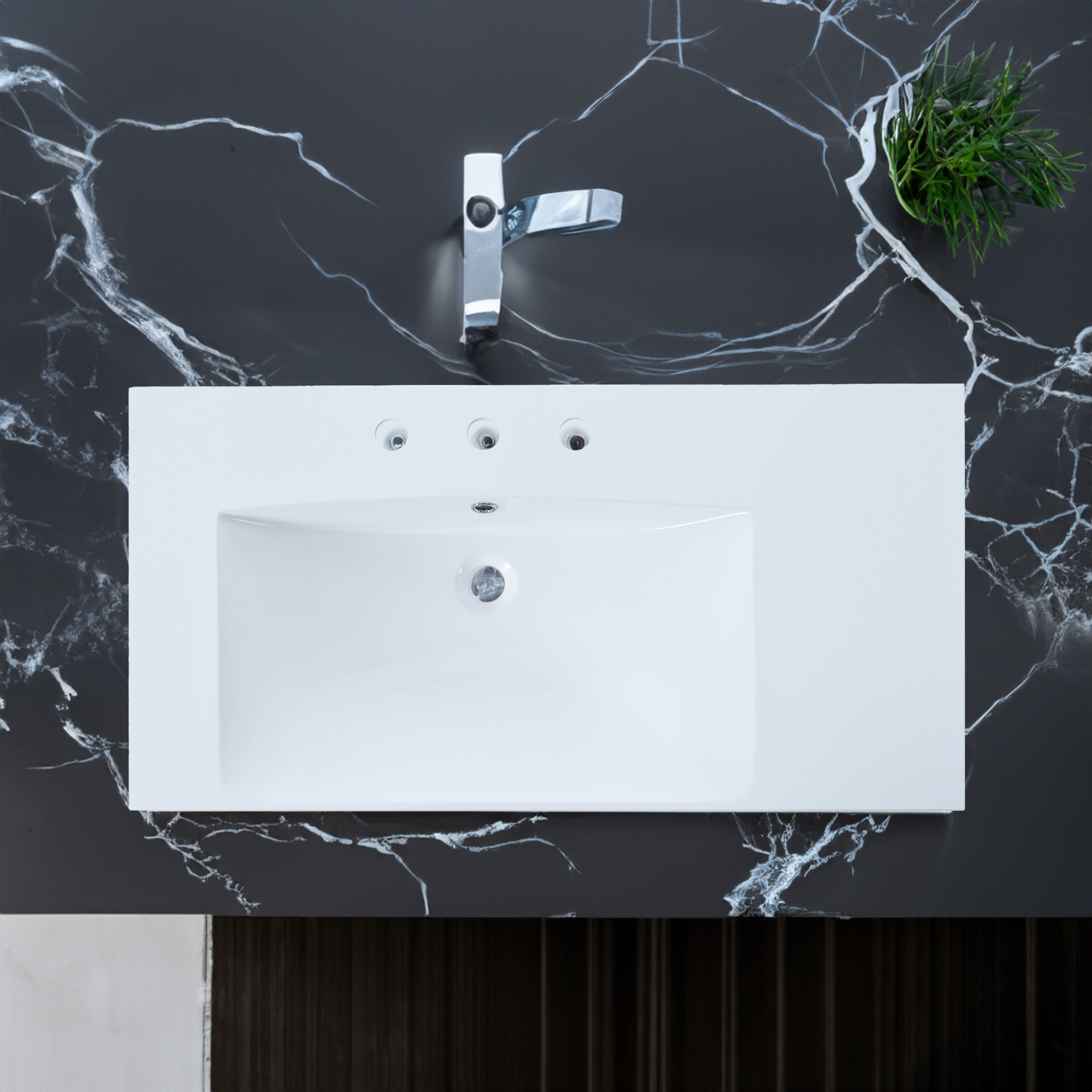 White vanity top with chrome faucet in a bathroom