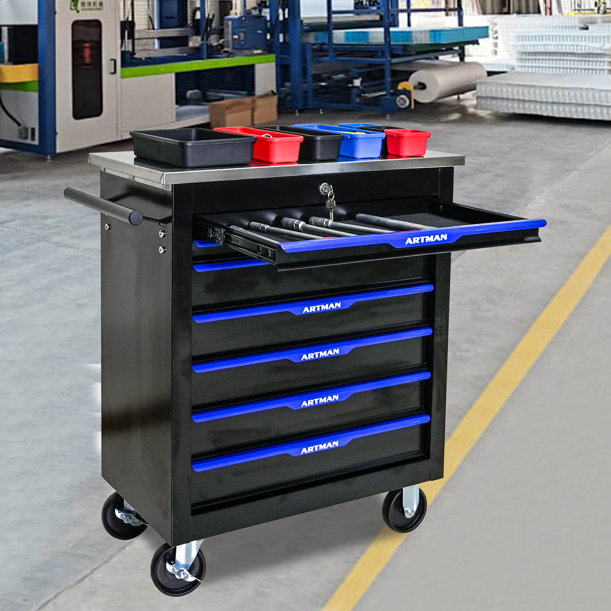 Top drawer pulled out showing wrenches and sockets with parts trays on top
