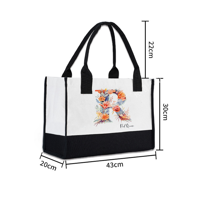 Custom colorblock handbag with floral "R" initial made of linen cotton, with black handles.