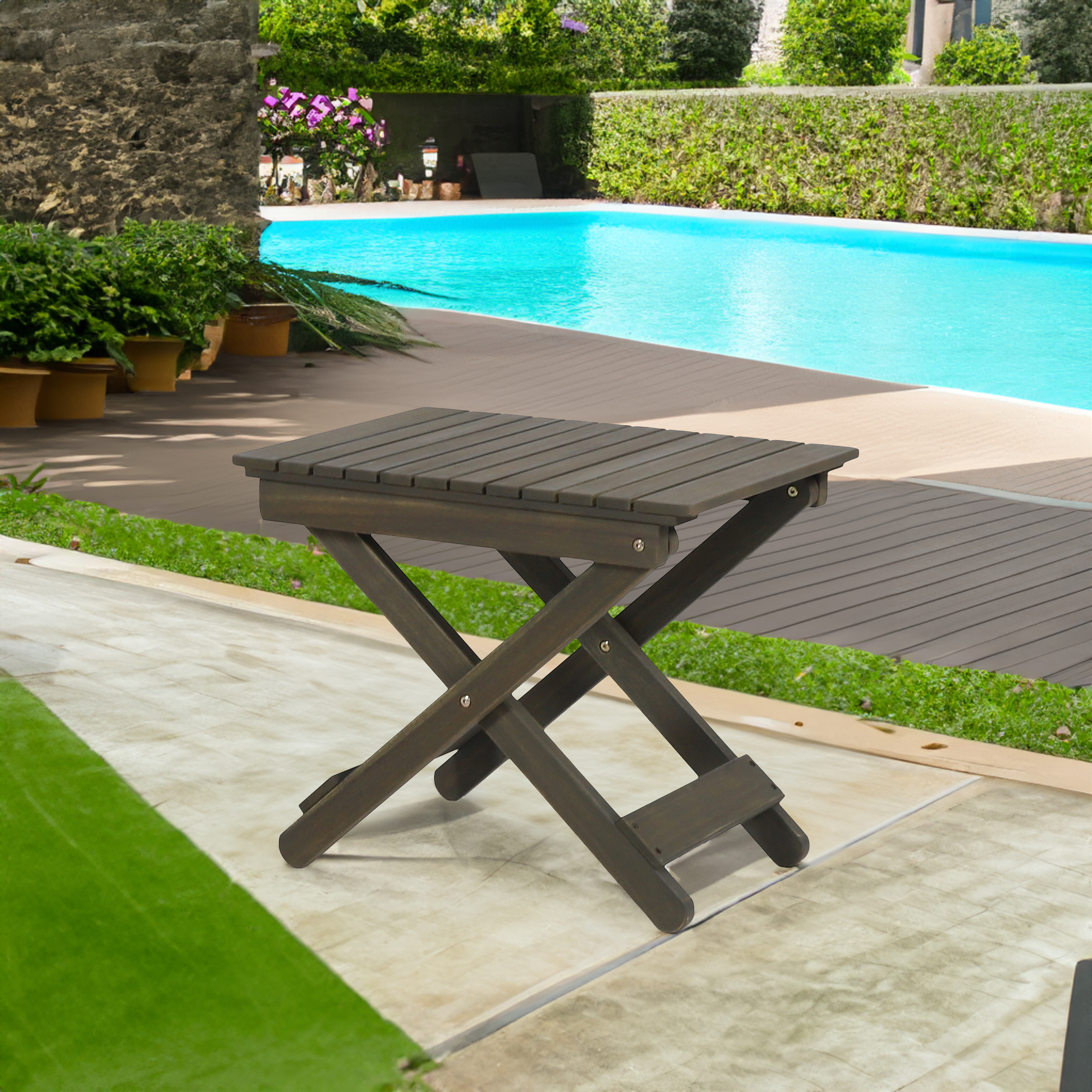Poolside patio with a lounger and no surface nearby