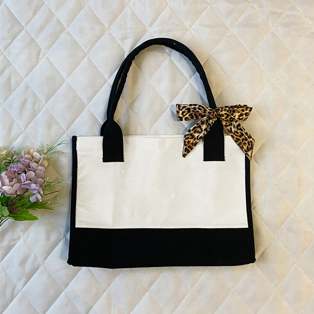 Colorblock handbag with black handle and bowknot, made of linen cotton composite