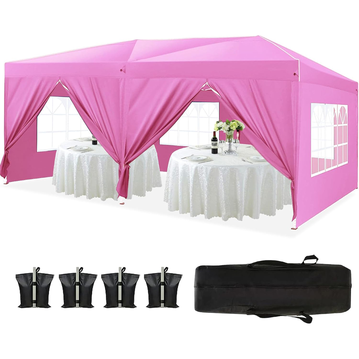 Four black leg weight bags and carry bag laid beside pink canopy