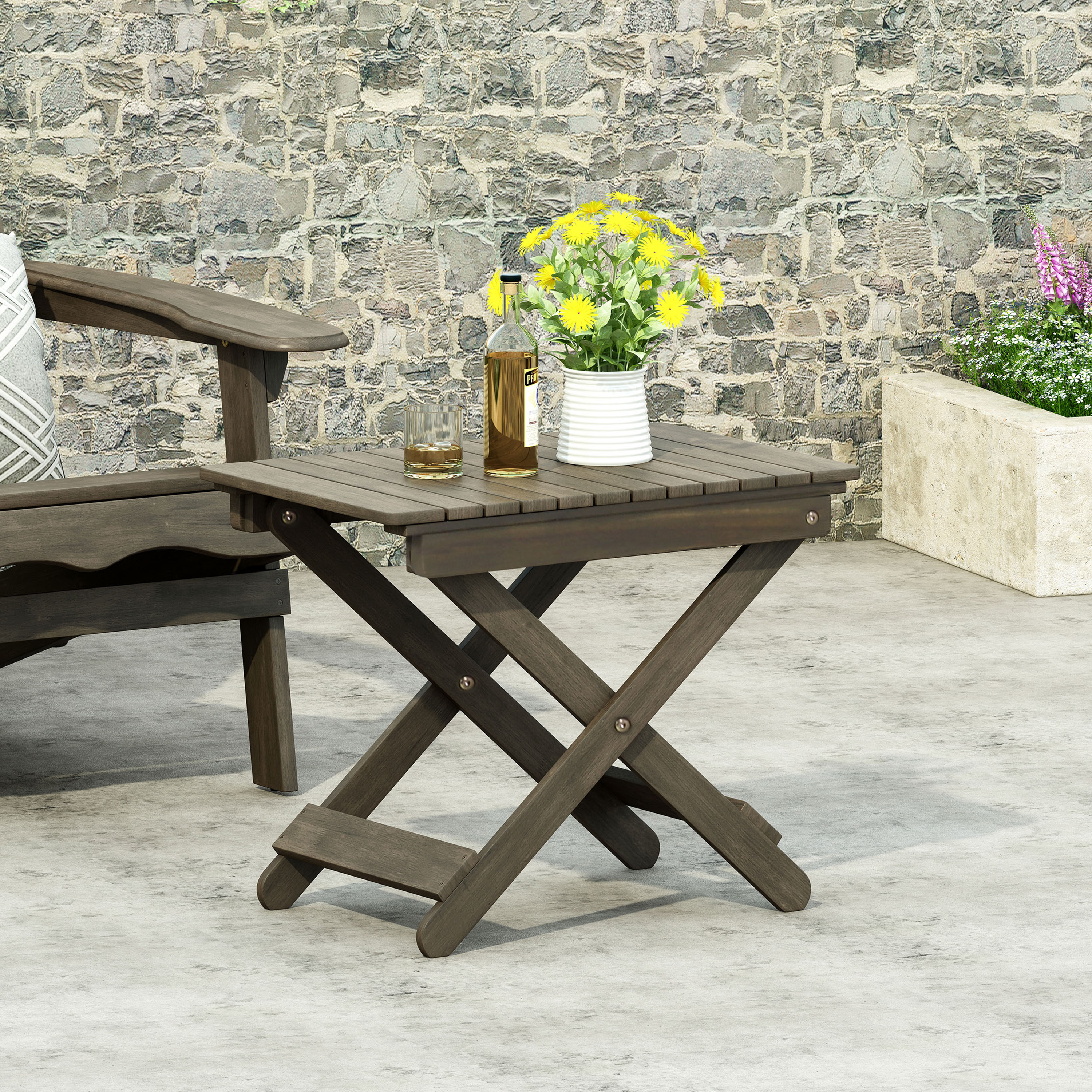 Gray side table beside a lounge chair holding drinks