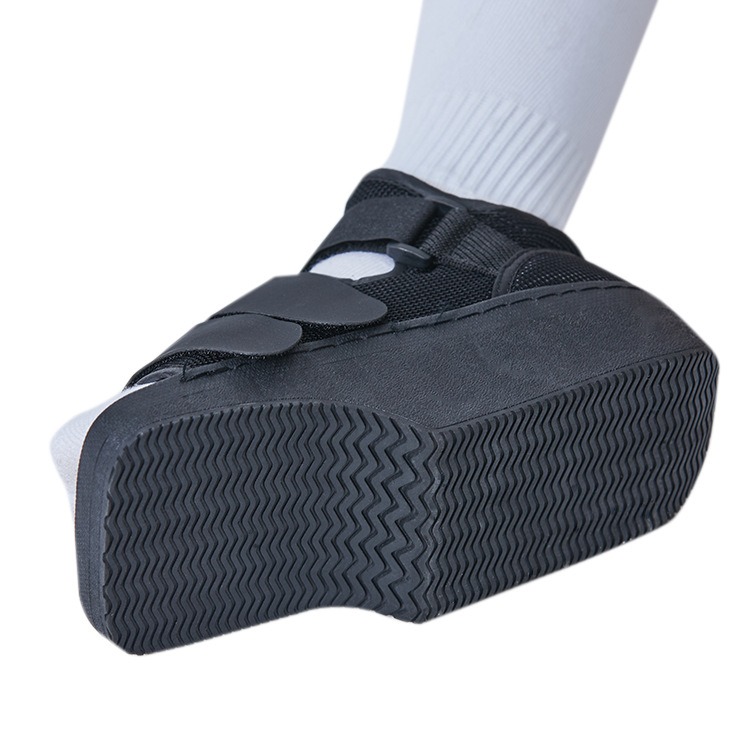 Bottom sole view showing chevron tread pattern and cushioned rigid platform