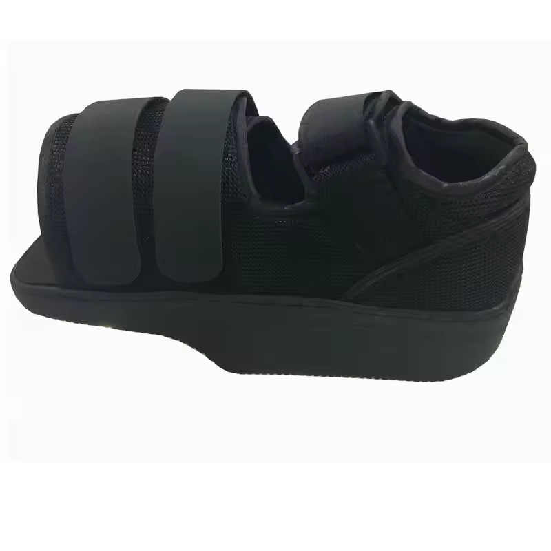 Side profile view of black decompression shoe showing rigid platform sole and dual velcro strap system