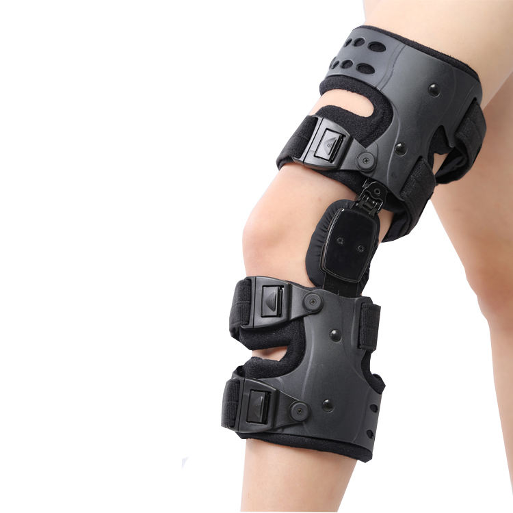 Close-up side view of dark gray brace showing ventilation holes, metal rivets, and breathable neoprene padding