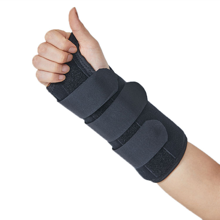 Person wearing brace with thumb extended upward showing forearm and wrist coverage in extended position