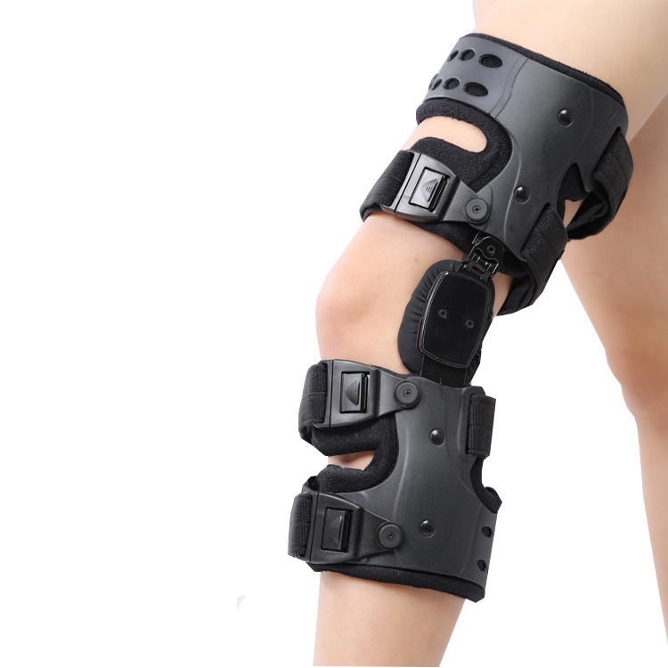 Person sitting with knee grasped in discomfort, illustrating the daily strain of knee instability