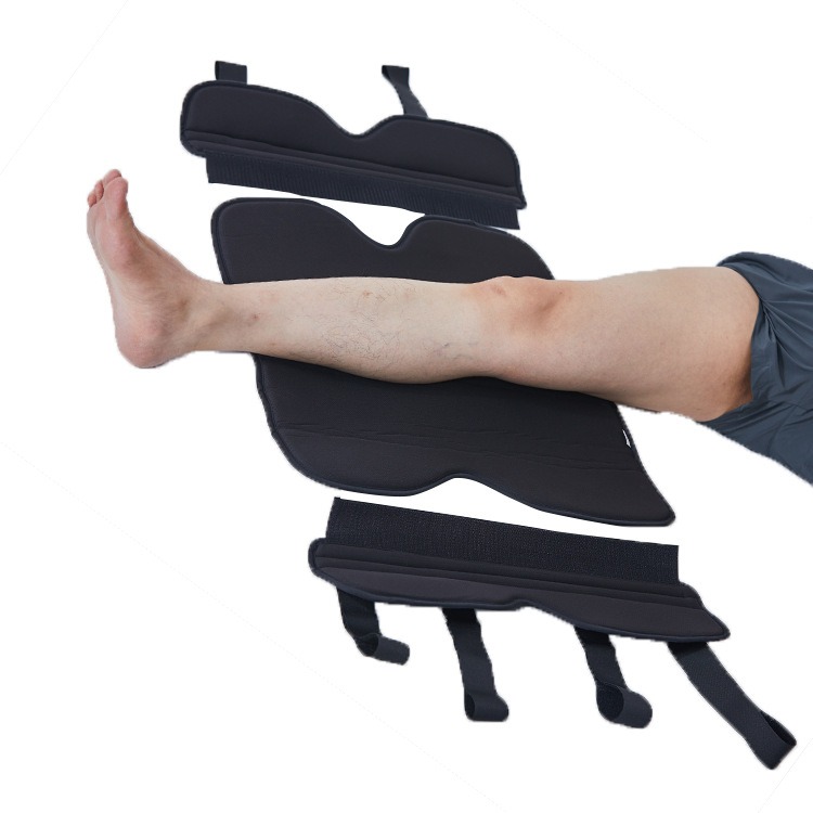Disassembled components of knee brace laid out showing soft padding, rigid shells, and compression straps