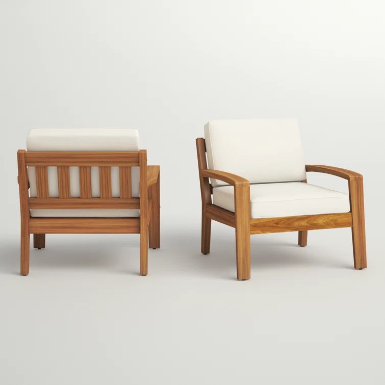 Angled view of teak lounge chair showing curved open armrests