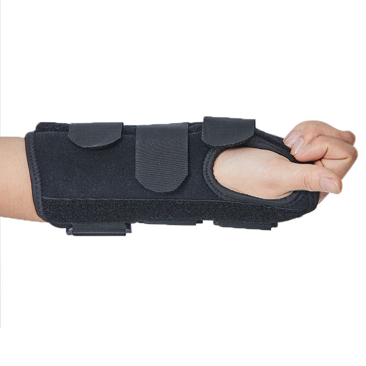 Wrist brace worn on forearm showing flat palm opening and contoured compression panels