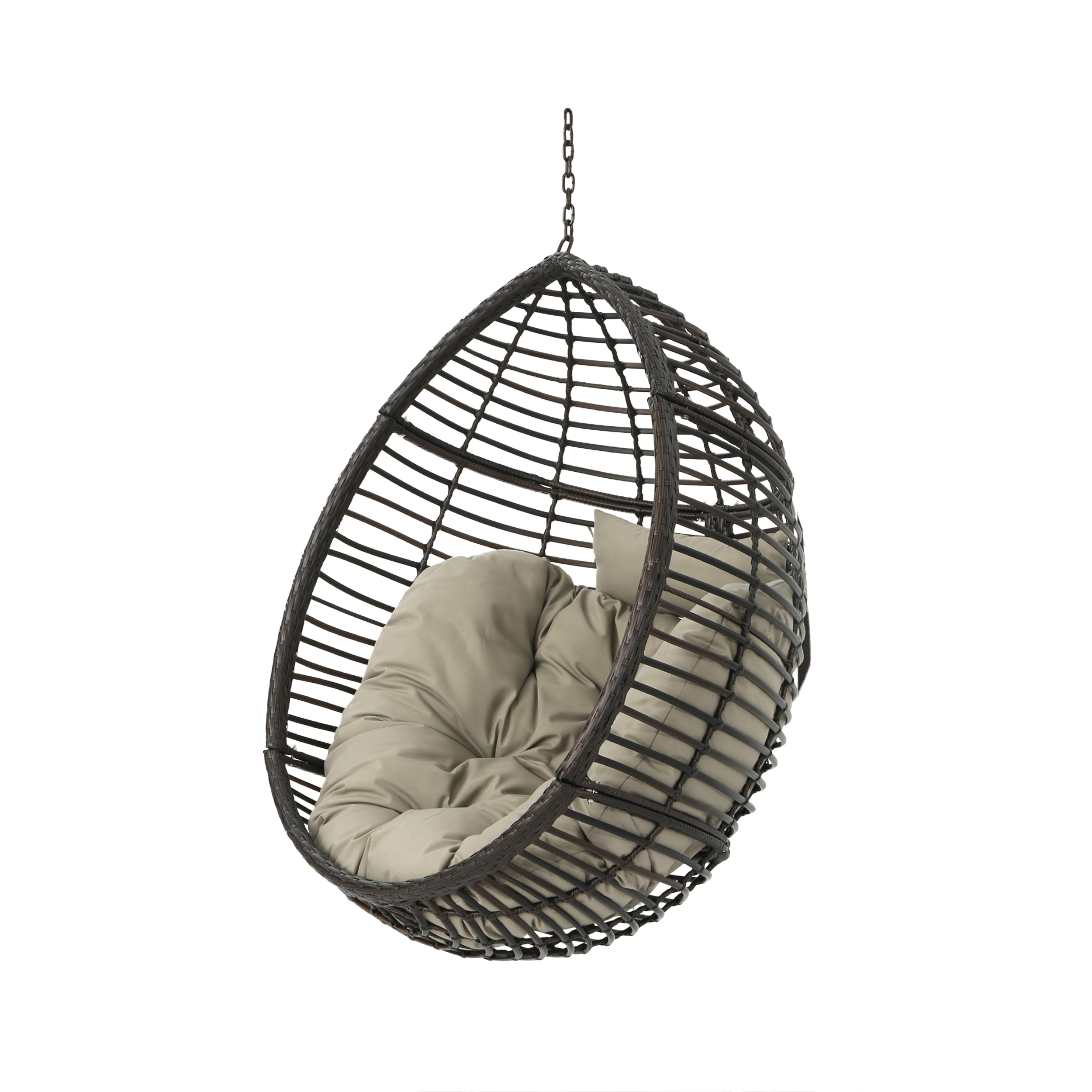 Woven egg-shaped hanging chair set up in a quiet outdoor corner