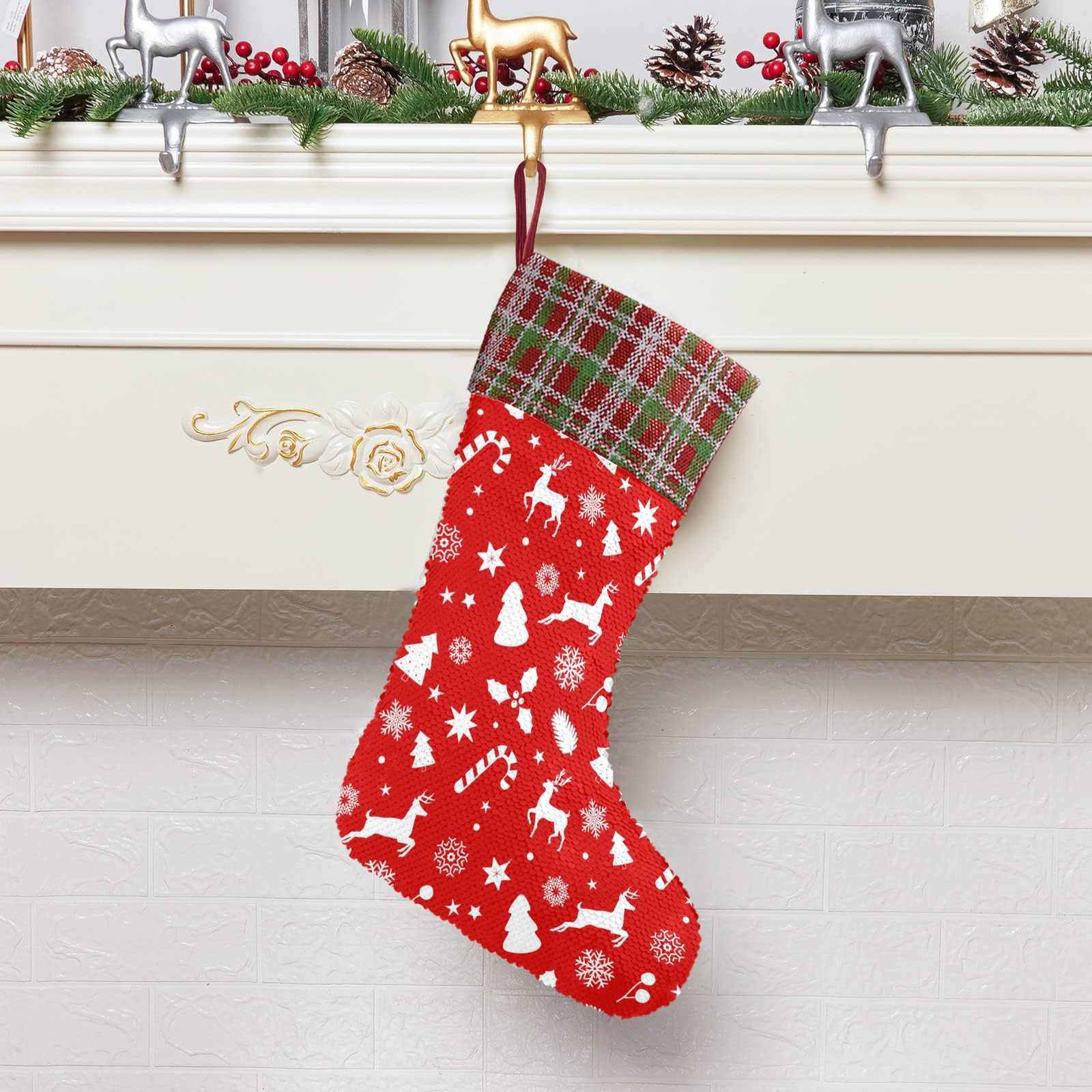 Sequin Christmas stocking with red reindeer pattern and plaid cuff, perfect for holiday decor and gift-giving.