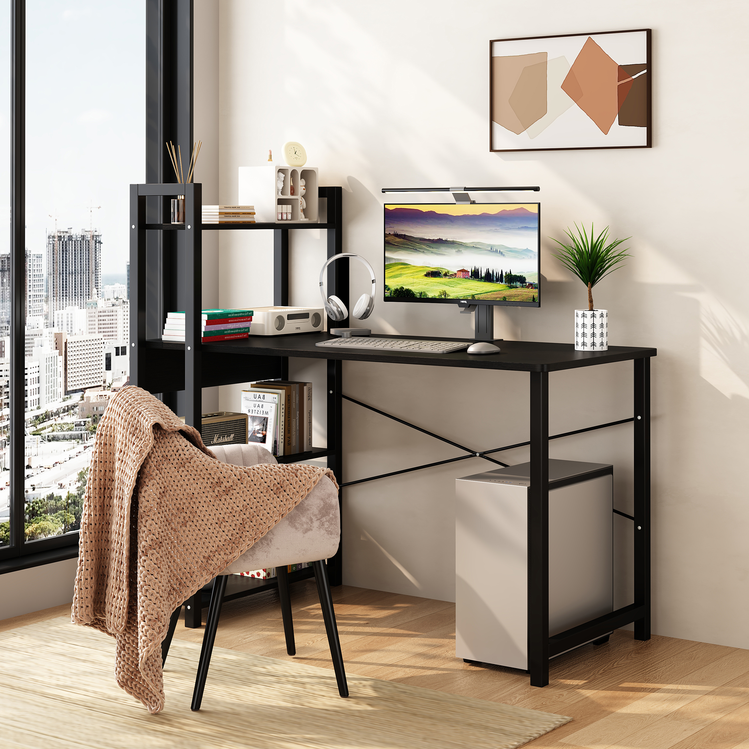 Open shelves on the left side of a black desk holding books and décor