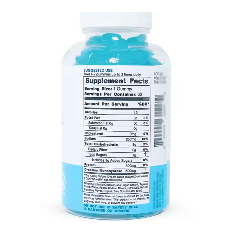 Hand holding the clear bottle against a gym background, demonstrating portable size and convenient daily use