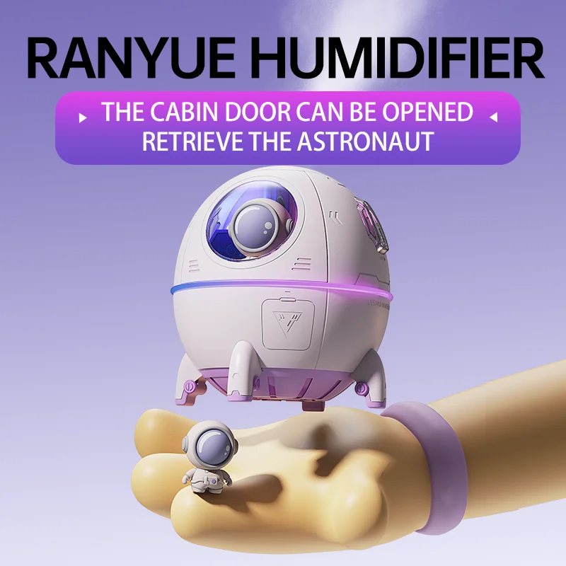 Hand holding a tiny astronaut figure below a floating capsule humidifier