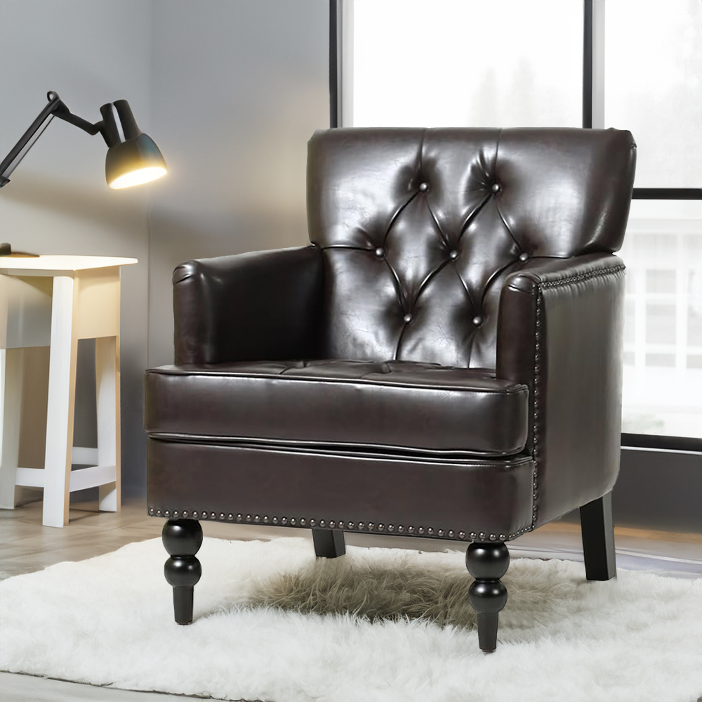 Dark brown club chair with black turned legs in a sunlit interior