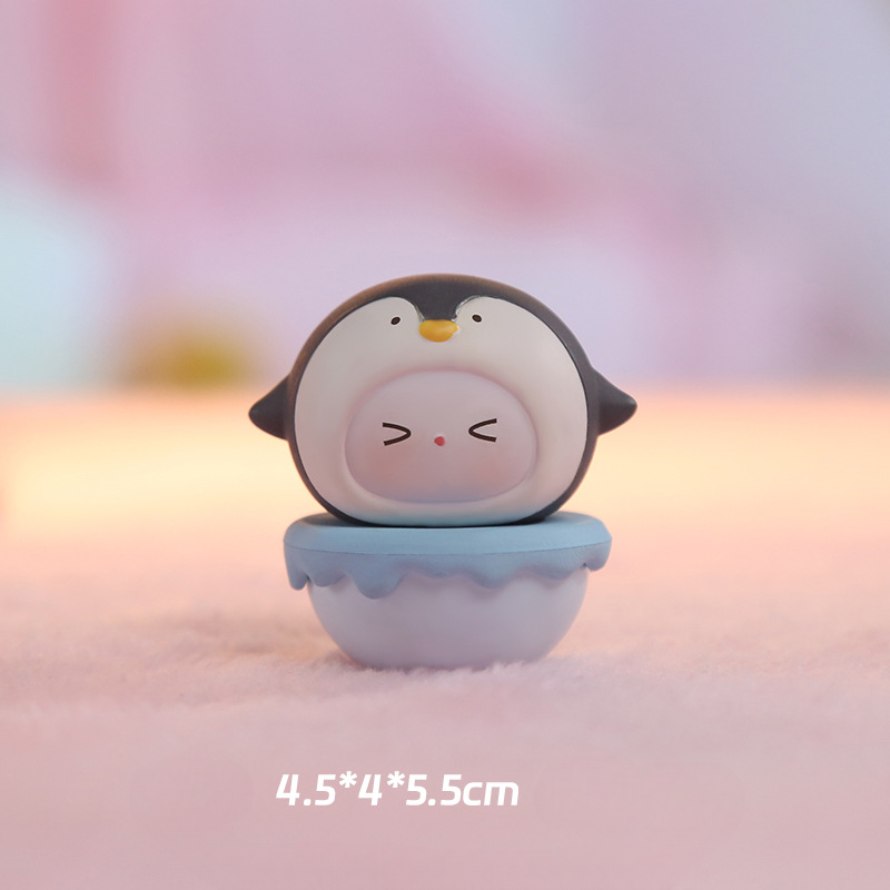 Wobbly figurine on a desk tilted back on its rounded base