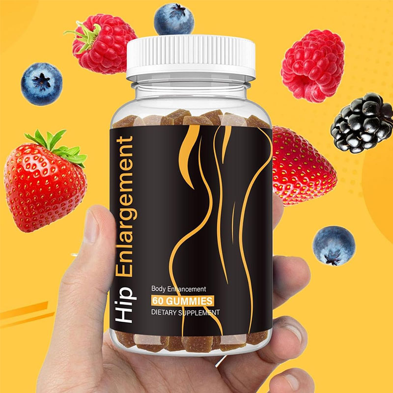 Hand holding the bottle against bright yellow background with fresh berries, symbolizing hope and accessibility