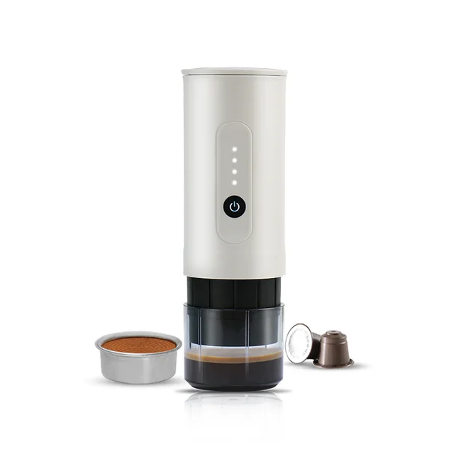 Green espresso maker parts set out for rinsing at a campsite sink