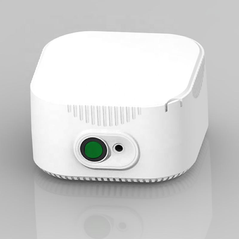Close-up of one-button operation with green power indicator on white compressor unit