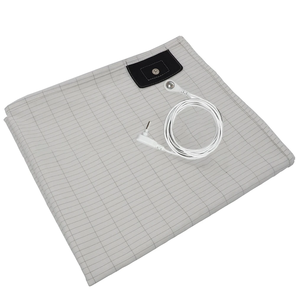 Grounding sheet laid flat with cord connected to black patch