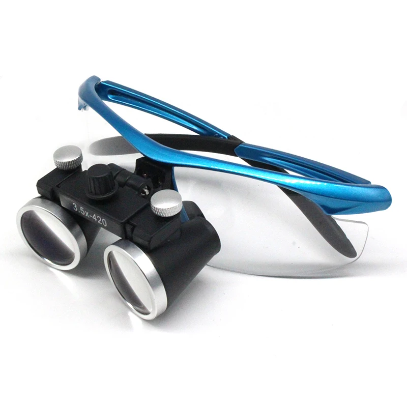Angled view of loupe housing with adjustment knobs and rubber grip pads