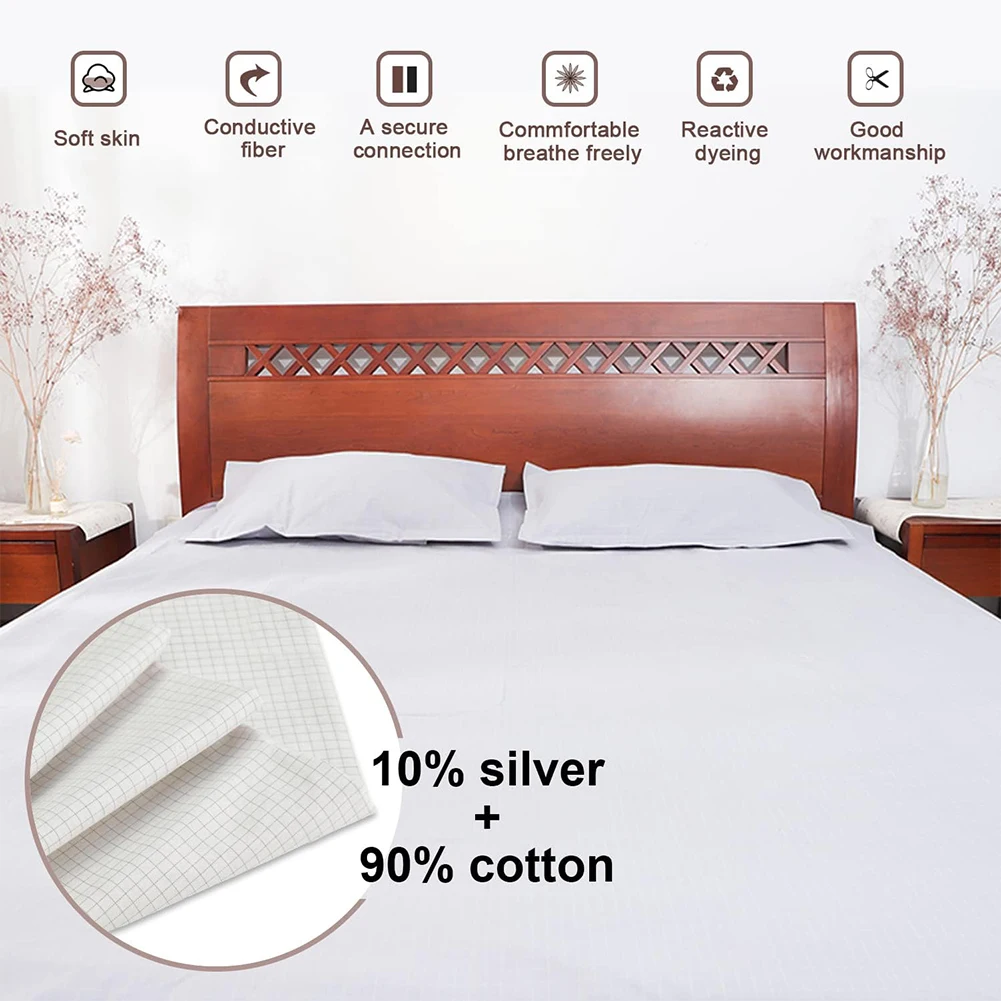 Grounding sheet on a bed with wooden headboard and pillows