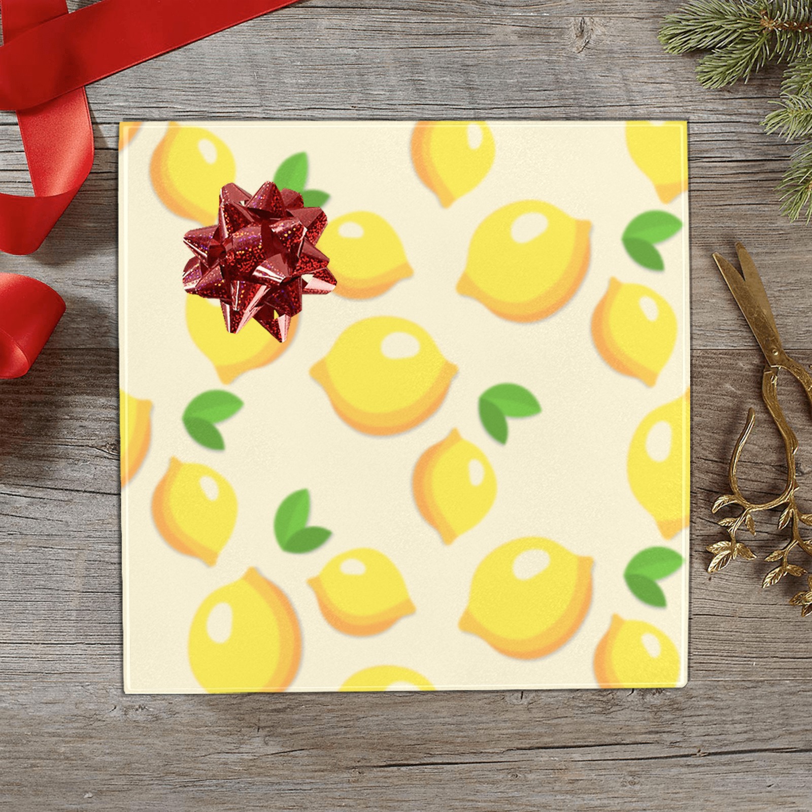 Lemon pattern gift wrapping paper with red bow, perfect for birthday gifts