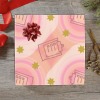 Pink gift wrapping paper on gift box with abstract pattern and bow