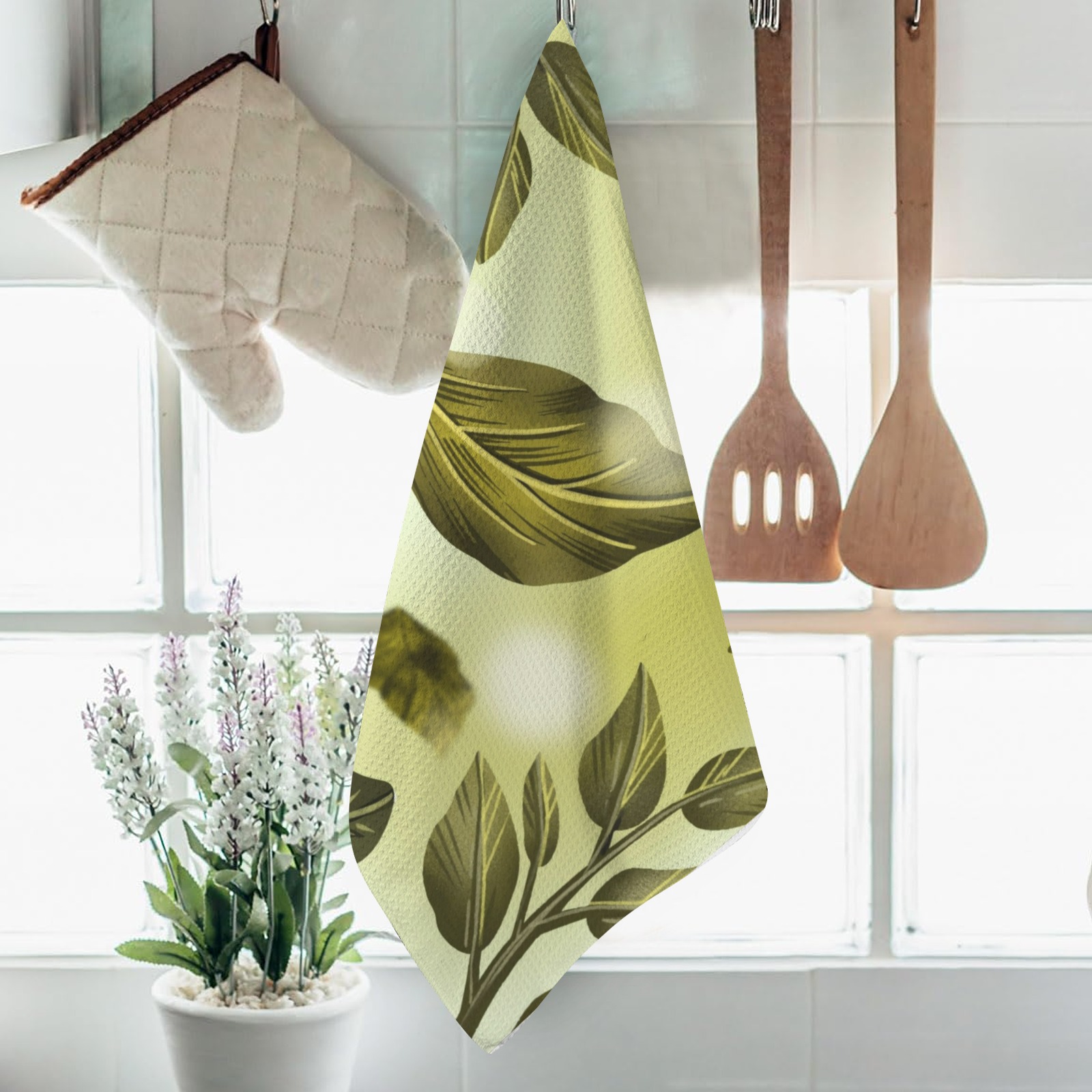 USA-made kitchen hand towel with green leaf pattern, soft and absorbent for bathroom or kitchen use.