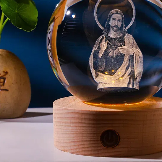 Side view of the crystal sphere on its wood base at dusk