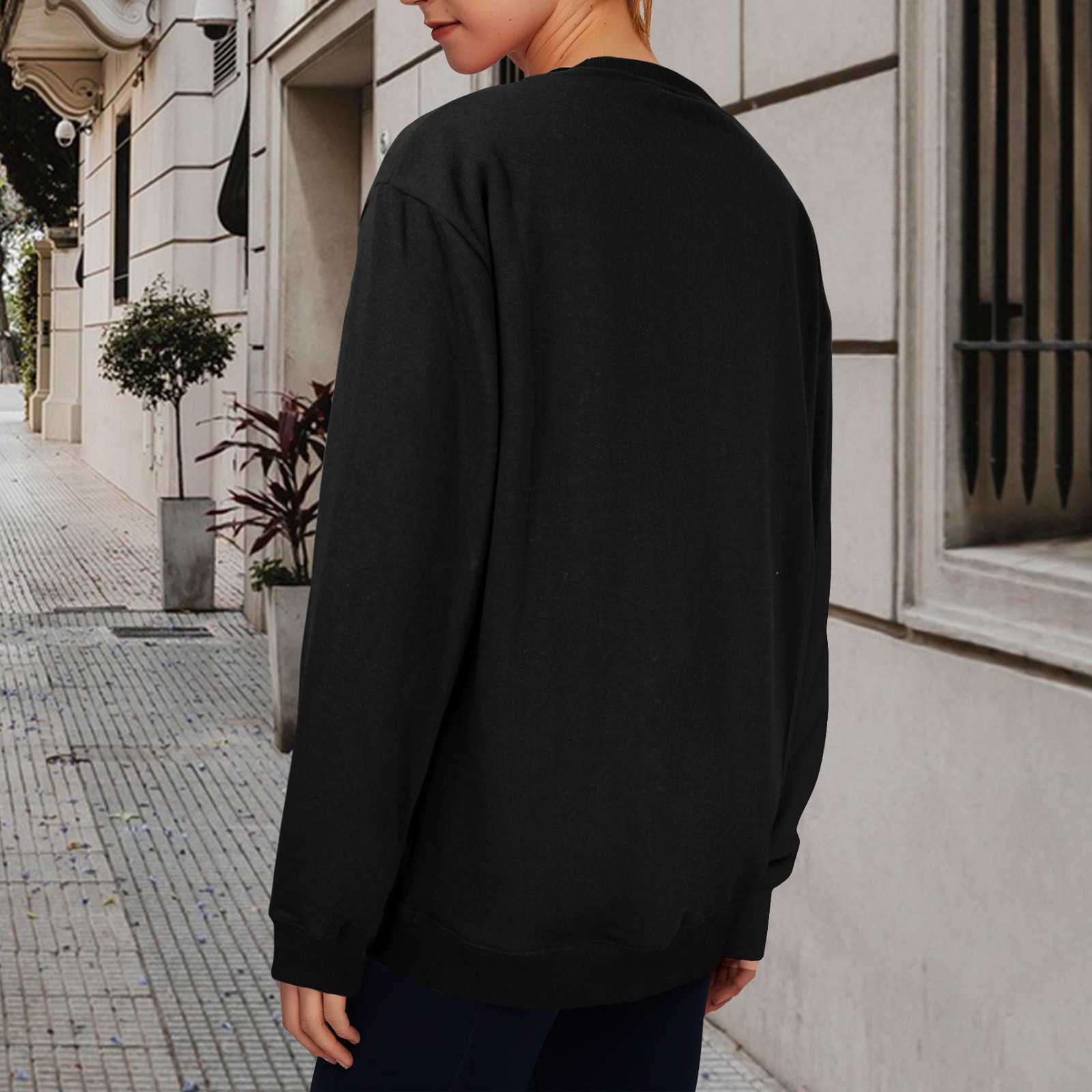 Back view of a black unisex fleece sweatshirt, made in USA, round neck, long sleeve