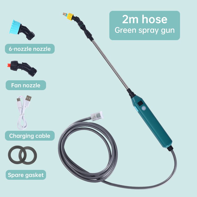Cordless sprayer with extended silver wand held near garden foliage