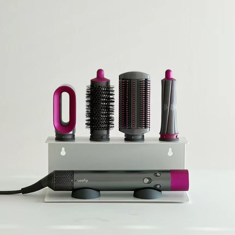 White wall rack with hair dryer resting on rubber-footed cradles
