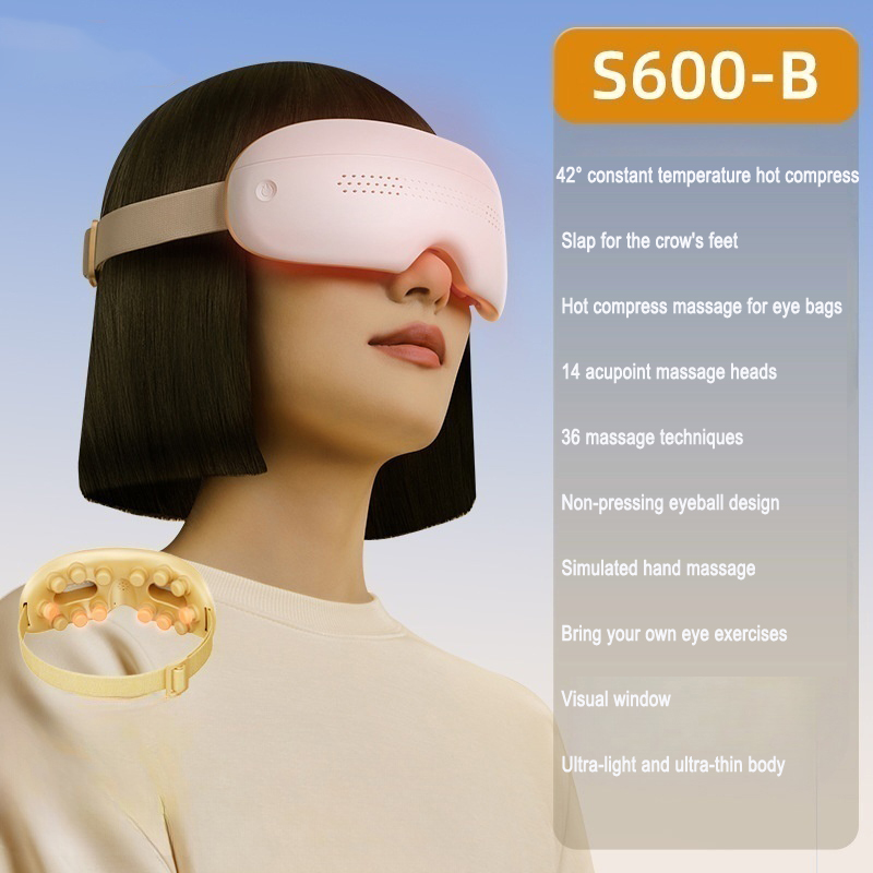 Cream eye massager worn by model with hot compress and massage features