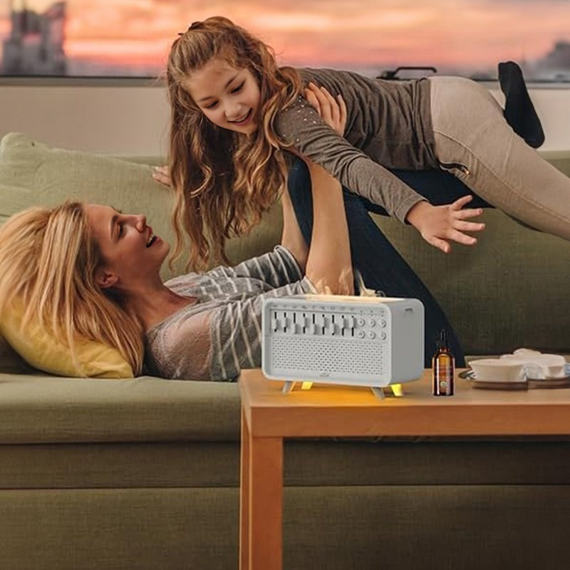 Family relaxing on a sofa beside the white diffuser and essential oil bottle