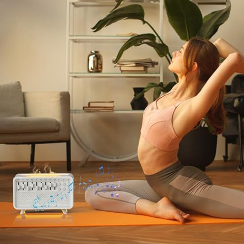 Woman stretching on a yoga mat beside the diffuser with mist