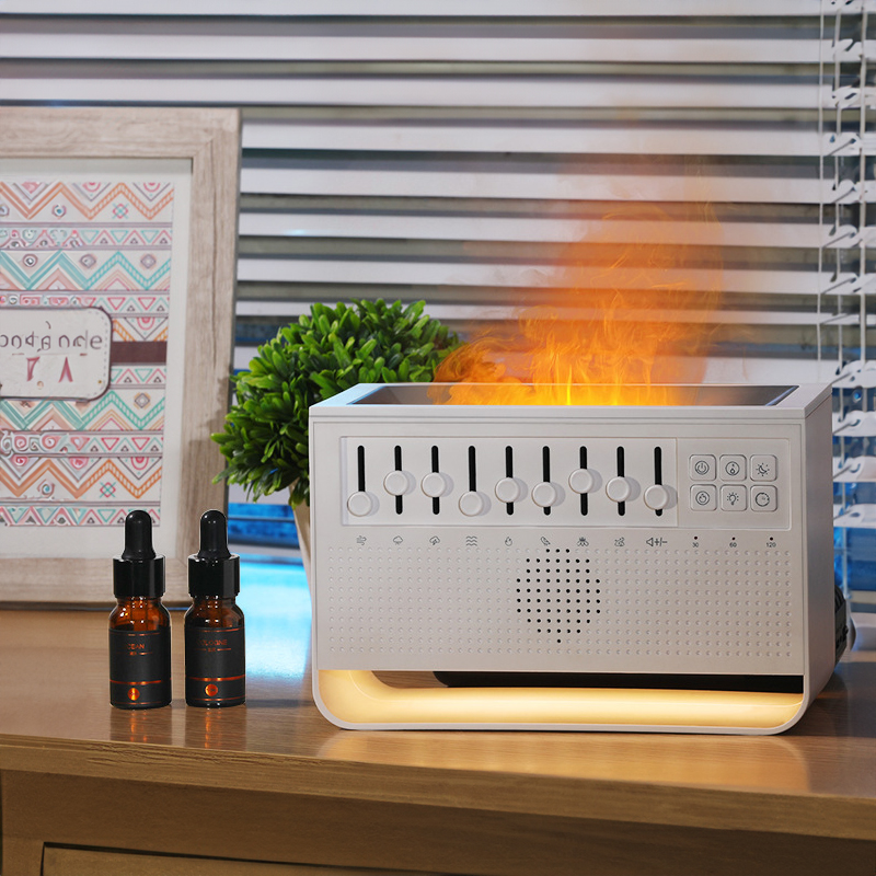 Essential oil diffuser on a wooden table beside two oil bottles