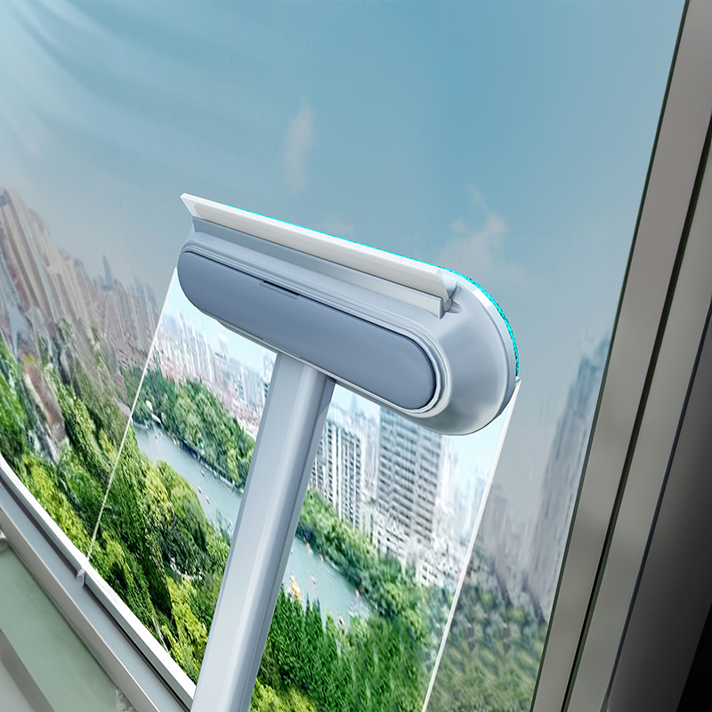 Brush wiping a high window to illustrate dual-surface capability