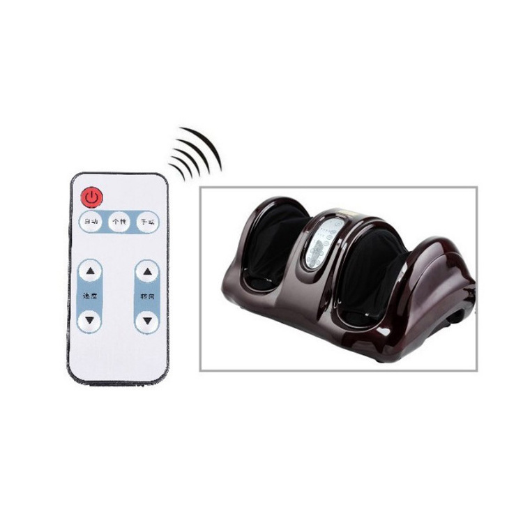 Brown foot massager beside its wireless remote control on a light surface