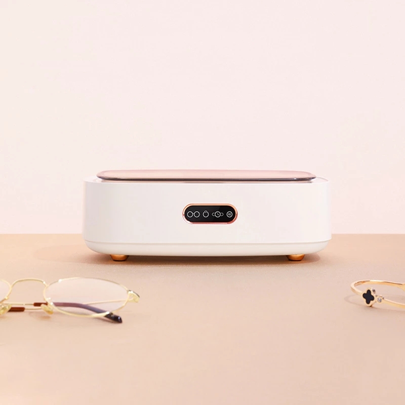 Front view of the cleaner with rose-gold touch panel and rubber feet
