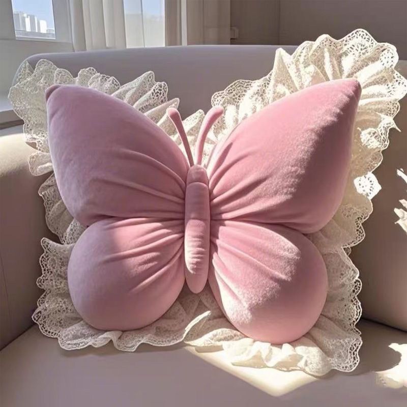 Blush pink velvet butterfly pillow with pleated wing detailing