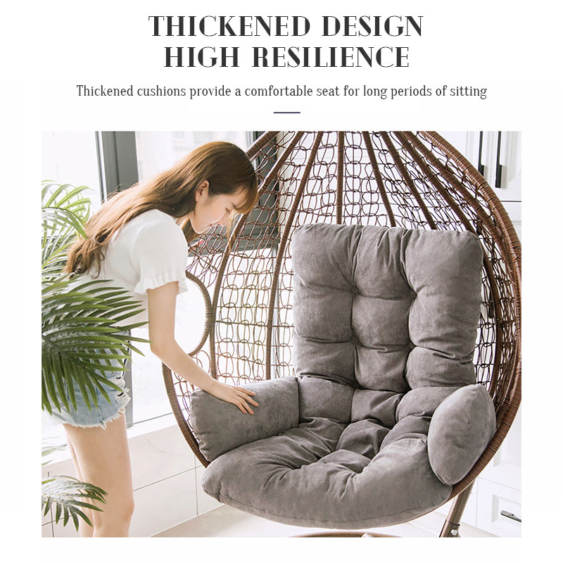 Relaxed reader in a plush egg chair cushion in a sunroom corner