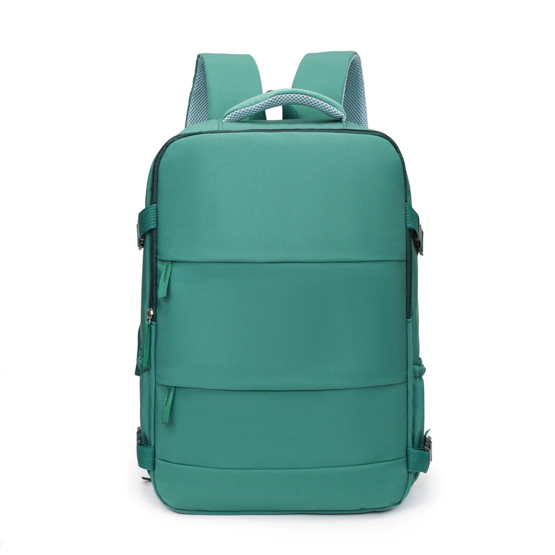 Teal green travel backpack showing padded mesh handle and shoulder straps