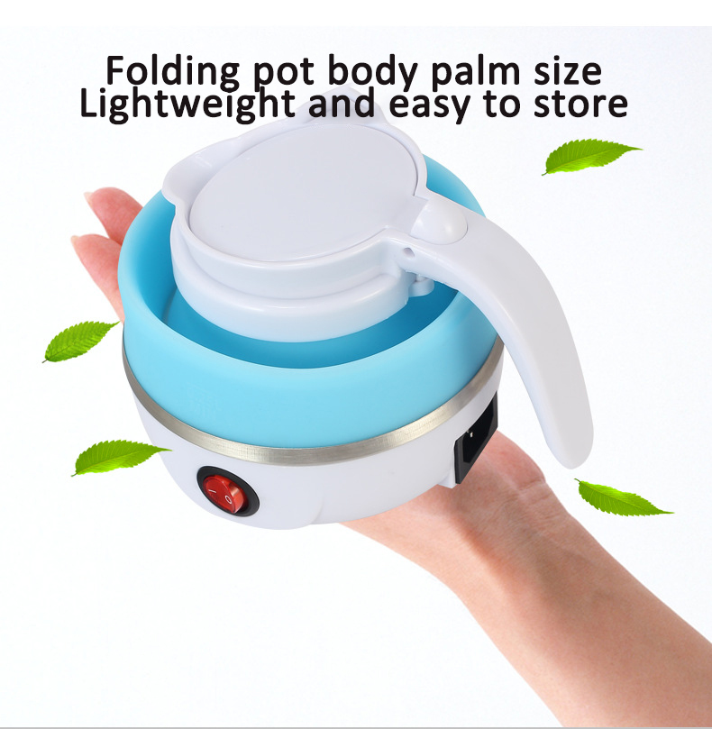 Folded mini silicone kettle held in an open palm showing its palm-size body
