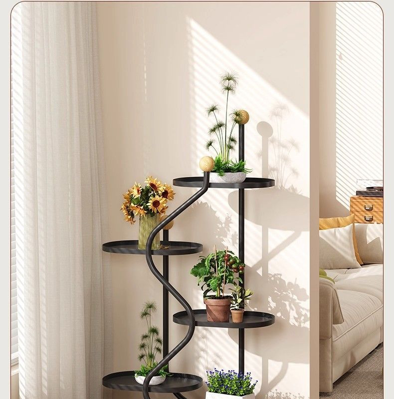 Beige living room corner styled with sunflowers, fern and tomato plant