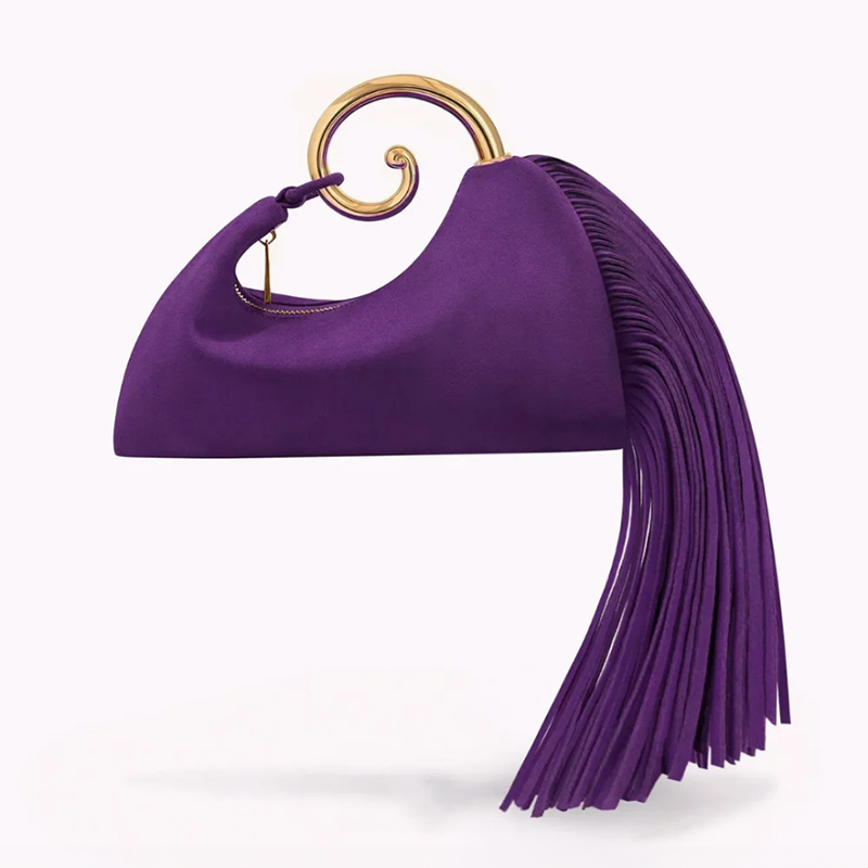 Royal purple suede clutch with gold spiral handle and tassel fringe, angled view