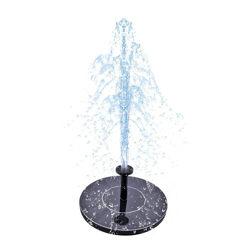 Solar fountain decor with lily and lotus floats on a garden pond