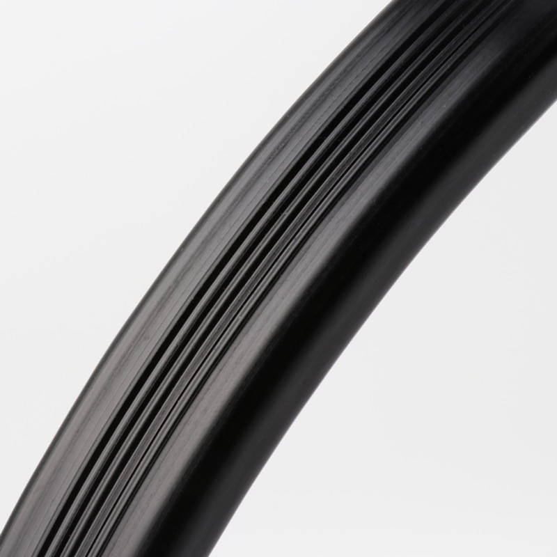Close-up of ribbed black plastic on the flexible nozzle body